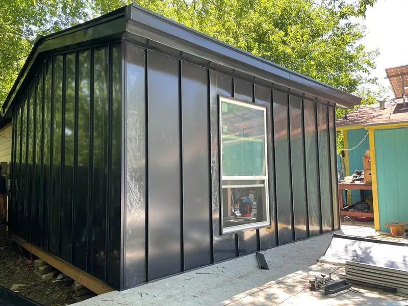 Black standing seam metal wall panels for Roof Inspection in Ladue