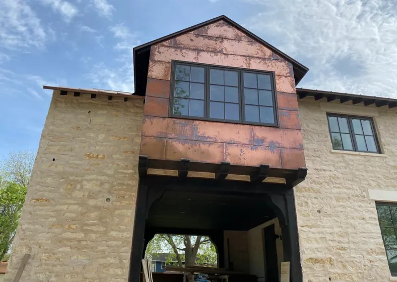 Copper metal panel facade on a stone building for Metal Roof Coating in Ladue