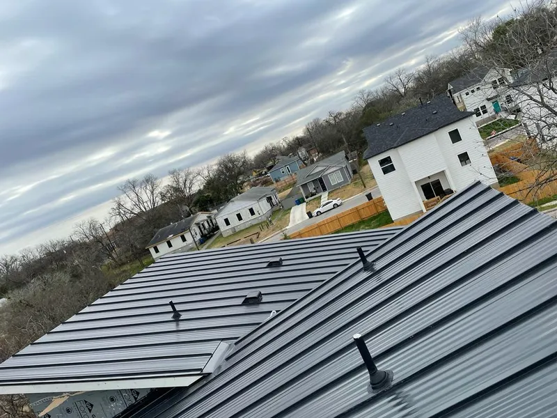 Standing seam metal roof panels with vents for Skylight Repair in Ladue